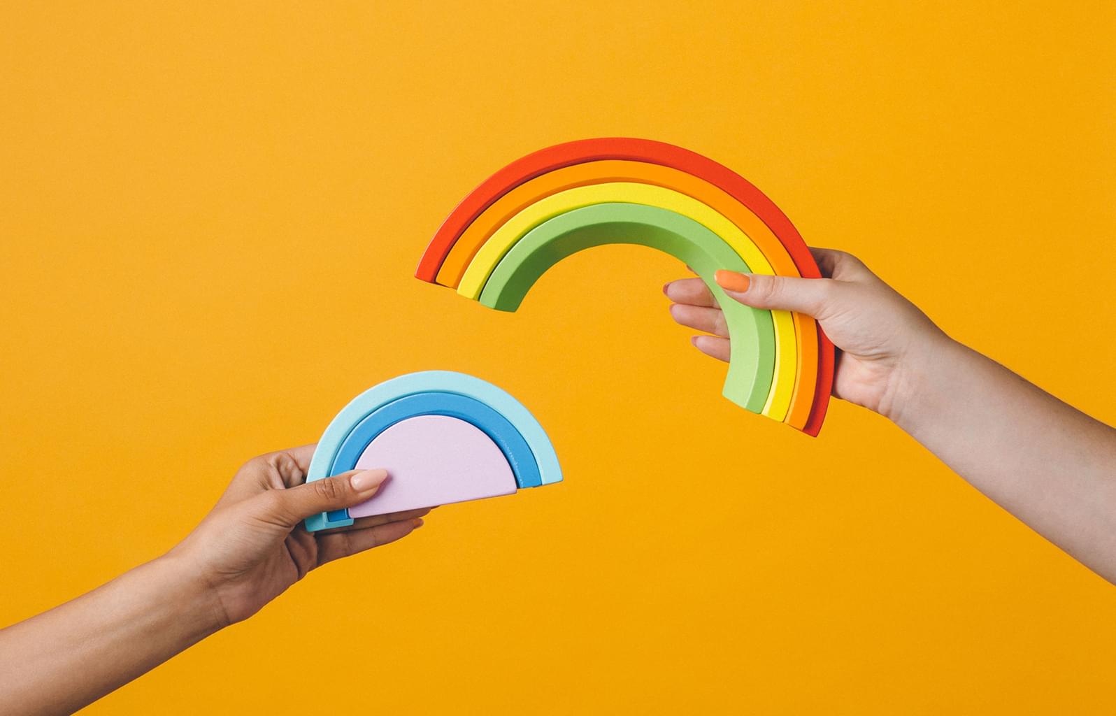 Building blocks in the color and shape of a rainbow, which represent how rare and special it is to become a successful startup